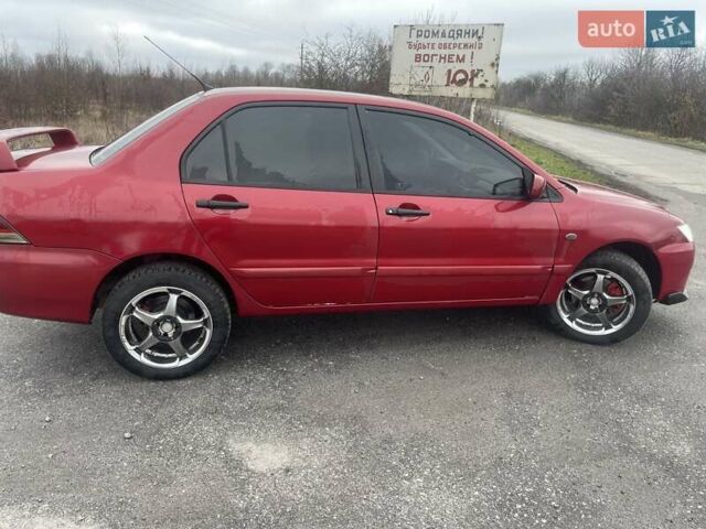 Красный Мицубиси Лансер, объемом двигателя 1.3 л и пробегом 250 тыс. км за 3450 $, фото 4 на Automoto.ua