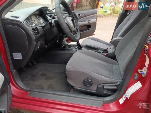 Червоний Міцубісі Lancer, об'ємом двигуна 1.3 л та пробігом 223 тис. км за 4250 $, фото 34 на Automoto.ua