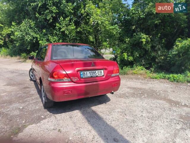 Красный Мицубиси Лансер, объемом двигателя 1.6 л и пробегом 400 тыс. км за 3100 $, фото 4 на Automoto.ua