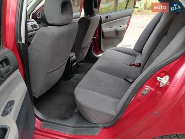 Червоний Міцубісі Lancer, об'ємом двигуна 1.3 л та пробігом 223 тис. км за 4250 $, фото 35 на Automoto.ua