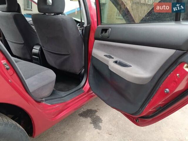 Червоний Міцубісі Lancer, об'ємом двигуна 1.3 л та пробігом 223 тис. км за 4250 $, фото 28 на Automoto.ua