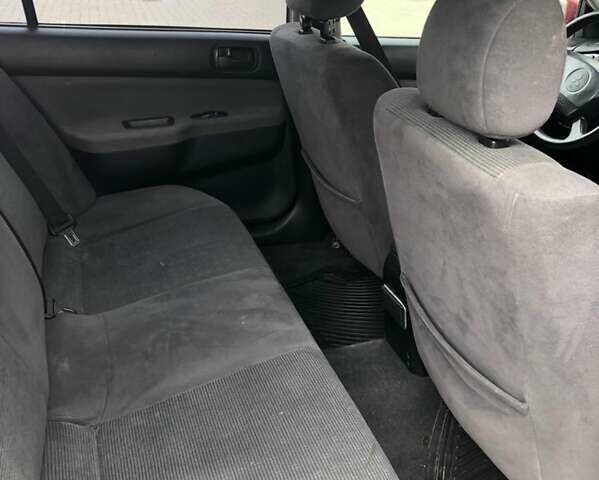 Красный Мицубиси Лансер, объемом двигателя 1.6 л и пробегом 224 тыс. км за 5500 $, фото 13 на Automoto.ua