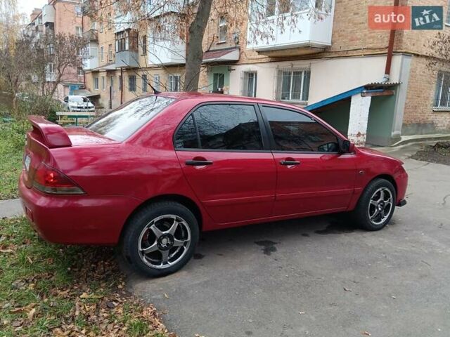 Червоний Міцубісі Lancer, об'ємом двигуна 1.3 л та пробігом 223 тис. км за 4250 $, фото 9 на Automoto.ua