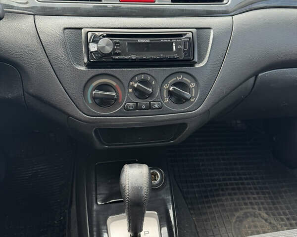 Червоний Міцубісі Lancer, об'ємом двигуна 1.58 л та пробігом 271 тис. км за 4100 $, фото 10 на Automoto.ua