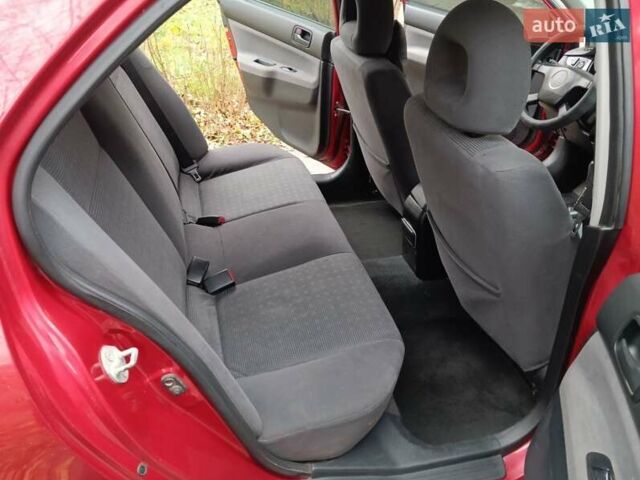 Червоний Міцубісі Lancer, об'ємом двигуна 1.3 л та пробігом 223 тис. км за 4250 $, фото 32 на Automoto.ua