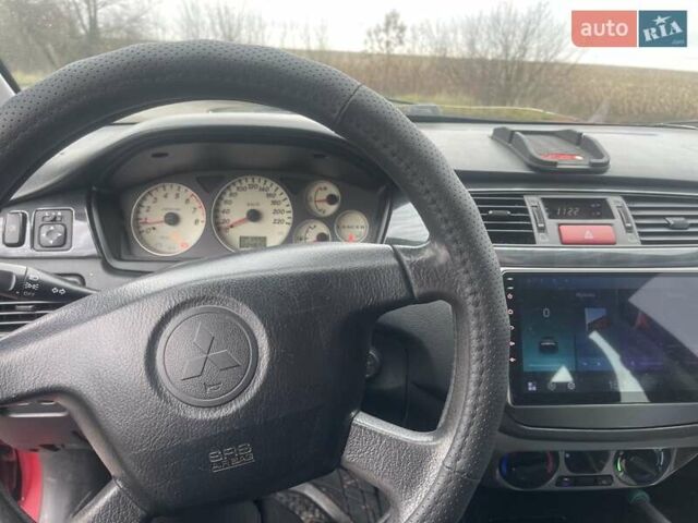 Красный Мицубиси Лансер, объемом двигателя 1.3 л и пробегом 250 тыс. км за 3450 $, фото 7 на Automoto.ua