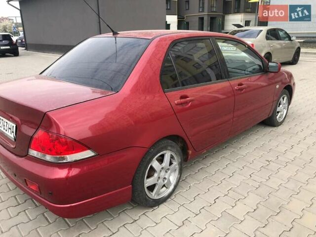 Красный Мицубиси Лансер, объемом двигателя 1.6 л и пробегом 224 тыс. км за 5500 $, фото 1 на Automoto.ua