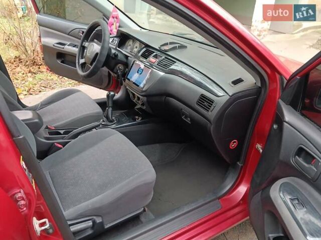 Червоний Міцубісі Lancer, об'ємом двигуна 1.3 л та пробігом 223 тис. км за 4250 $, фото 26 на Automoto.ua
