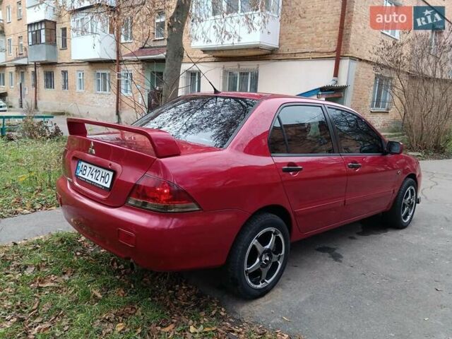 Червоний Міцубісі Lancer, об'ємом двигуна 1.3 л та пробігом 223 тис. км за 4250 $, фото 12 на Automoto.ua