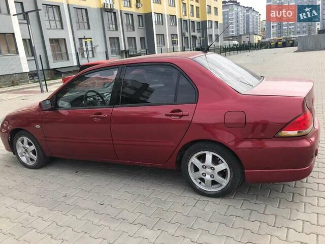 Красный Мицубиси Лансер, объемом двигателя 1.6 л и пробегом 224 тыс. км за 5500 $, фото 3 на Automoto.ua