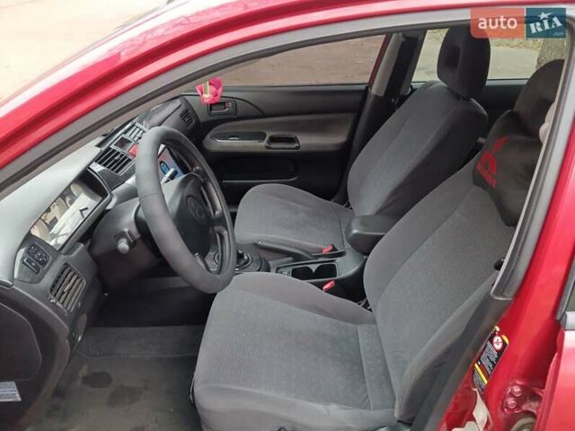 Червоний Міцубісі Lancer, об'ємом двигуна 1.3 л та пробігом 223 тис. км за 4250 $, фото 24 на Automoto.ua