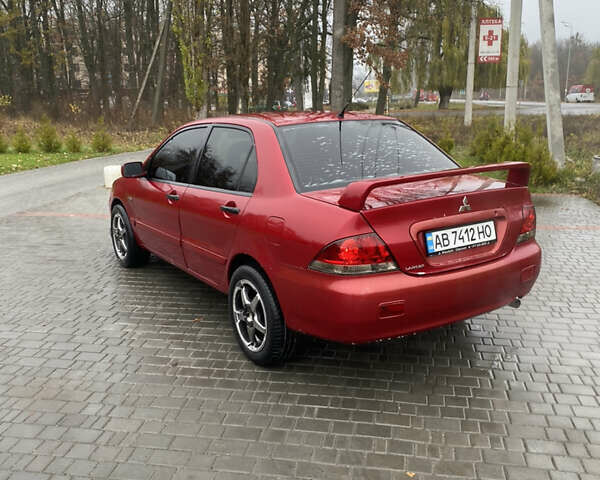 Червоний Міцубісі Lancer, об'ємом двигуна 1.58 л та пробігом 350 тис. км за 3600 $, фото 3 на Automoto.ua