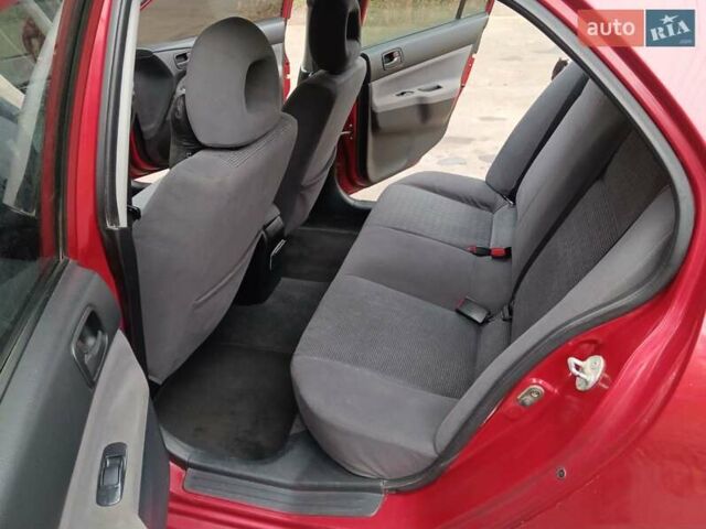 Червоний Міцубісі Lancer, об'ємом двигуна 1.3 л та пробігом 223 тис. км за 4250 $, фото 33 на Automoto.ua