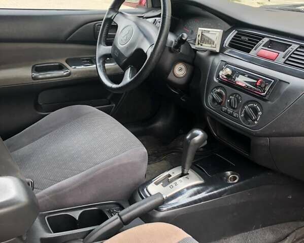 Красный Мицубиси Лансер, объемом двигателя 1.6 л и пробегом 224 тыс. км за 5500 $, фото 5 на Automoto.ua