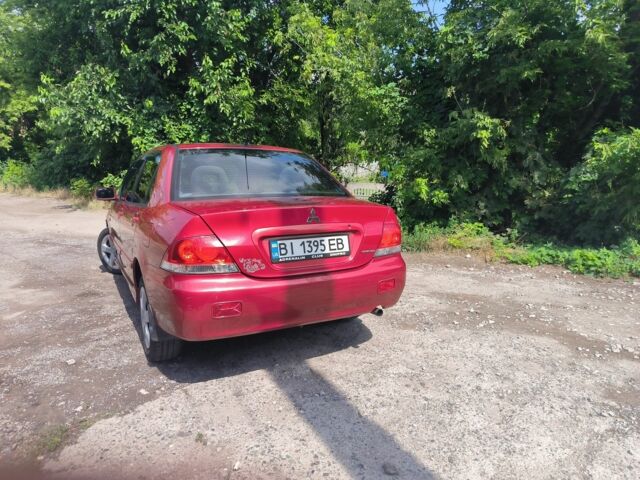 Красный Мицубиси Лансер, объемом двигателя 1 л и пробегом 2 тыс. км за 3100 $, фото 5 на Automoto.ua