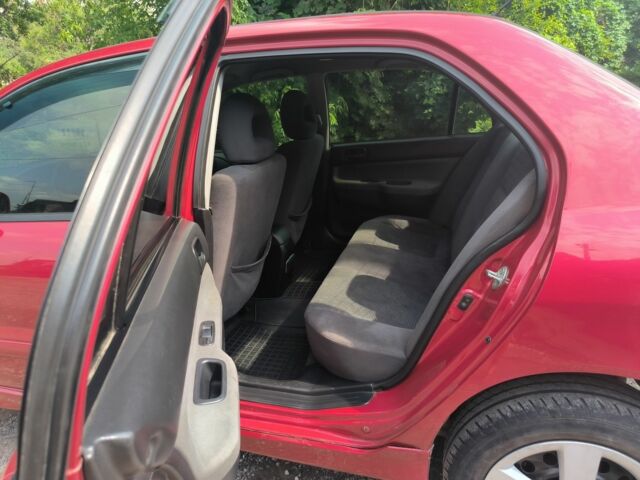 Красный Мицубиси Лансер, объемом двигателя 1 л и пробегом 2 тыс. км за 3100 $, фото 2 на Automoto.ua