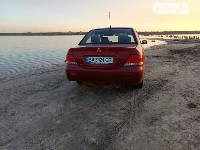 Червоний Міцубісі Lancer, об'ємом двигуна 1.58 л та пробігом 200 тис. км за 3400 $, фото 5 на Automoto.ua