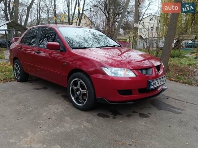 Червоний Міцубісі Lancer, об'ємом двигуна 1.3 л та пробігом 223 тис. км за 4250 $, фото 1 на Automoto.ua