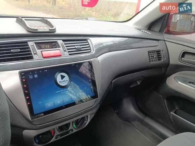 Червоний Міцубісі Lancer, об'ємом двигуна 1.3 л та пробігом 223 тис. км за 4250 $, фото 22 на Automoto.ua