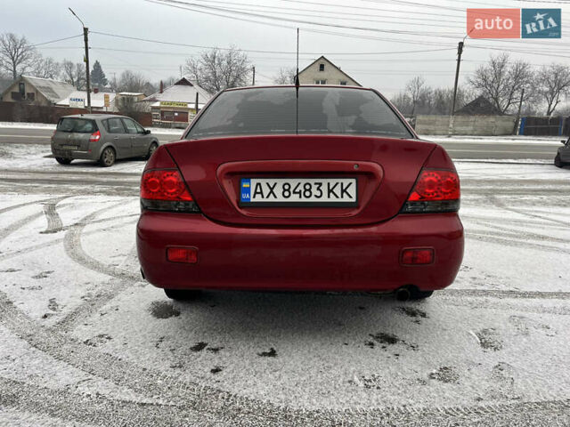 Красный Мицубиси Лансер, объемом двигателя 1.58 л и пробегом 355 тыс. км за 4350 $, фото 3 на Automoto.ua