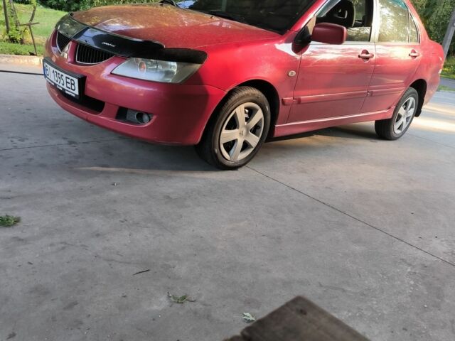 Красный Мицубиси Лансер, объемом двигателя 1 л и пробегом 2 тыс. км за 3100 $, фото 7 на Automoto.ua