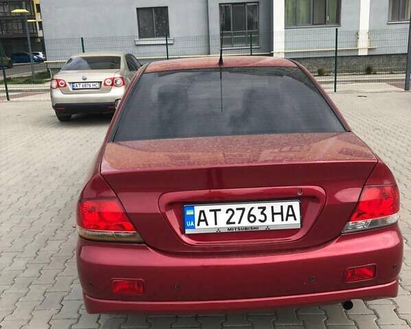 Красный Мицубиси Лансер, объемом двигателя 1.6 л и пробегом 224 тыс. км за 5500 $, фото 2 на Automoto.ua