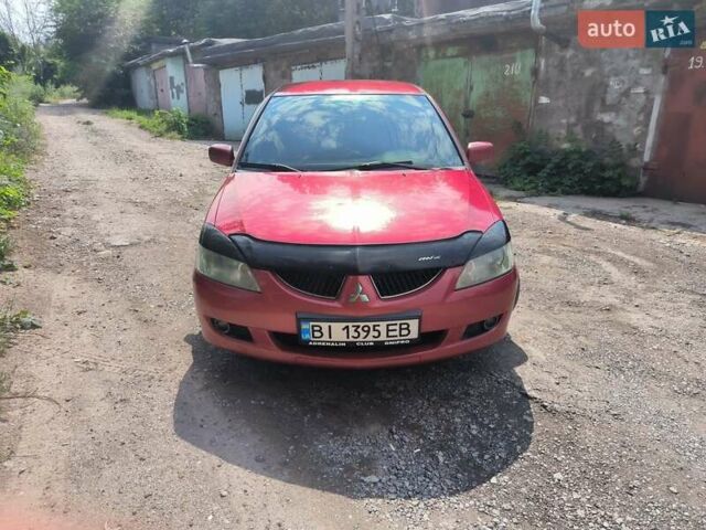 Красный Мицубиси Лансер, объемом двигателя 1.6 л и пробегом 400 тыс. км за 3100 $, фото 3 на Automoto.ua