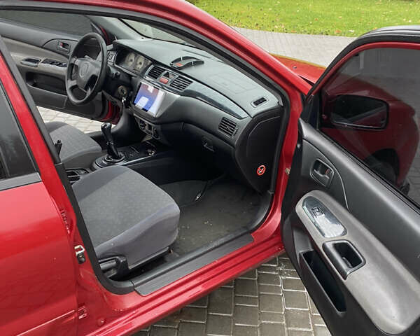 Червоний Міцубісі Lancer, об'ємом двигуна 1.58 л та пробігом 350 тис. км за 3600 $, фото 8 на Automoto.ua