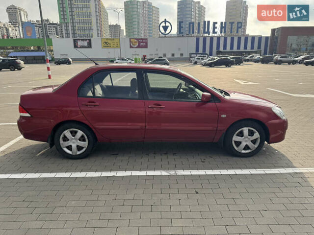 Червоний Міцубісі Lancer, об'ємом двигуна 1.58 л та пробігом 271 тис. км за 4100 $, фото 5 на Automoto.ua