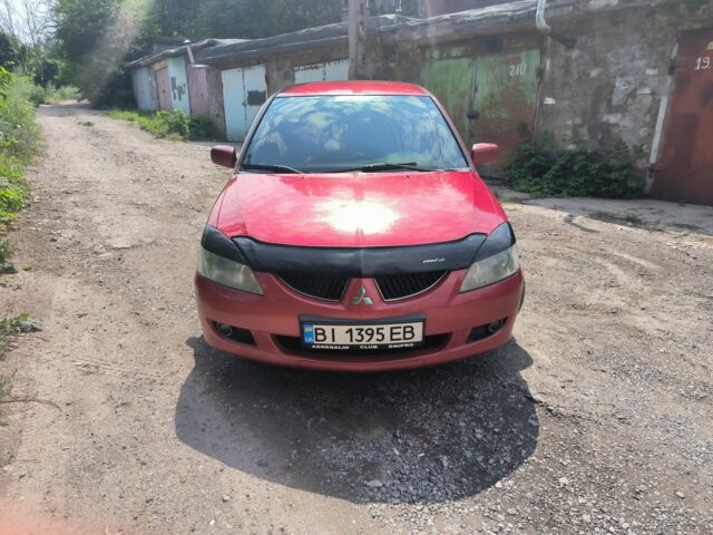 Красный Мицубиси Лансер, объемом двигателя 1 л и пробегом 2 тыс. км за 3100 $, фото 4 на Automoto.ua