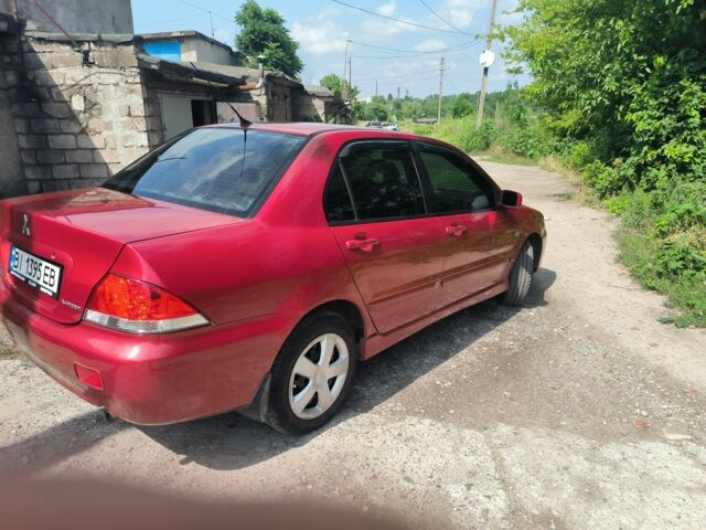 Красный Мицубиси Лансер, объемом двигателя 1 л и пробегом 2 тыс. км за 3100 $, фото 6 на Automoto.ua