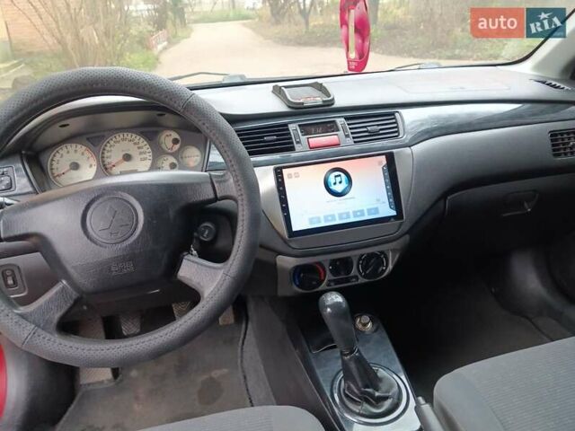 Червоний Міцубісі Lancer, об'ємом двигуна 1.3 л та пробігом 223 тис. км за 4250 $, фото 27 на Automoto.ua