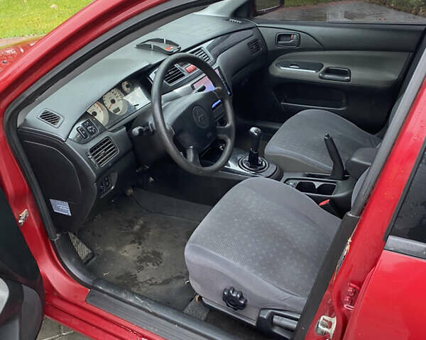 Червоний Міцубісі Lancer, об'ємом двигуна 1.58 л та пробігом 350 тис. км за 3600 $, фото 4 на Automoto.ua