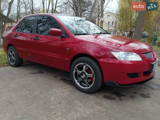 Червоний Міцубісі Lancer, об'ємом двигуна 1.3 л та пробігом 223 тис. км за 4250 $, фото 8 на Automoto.ua