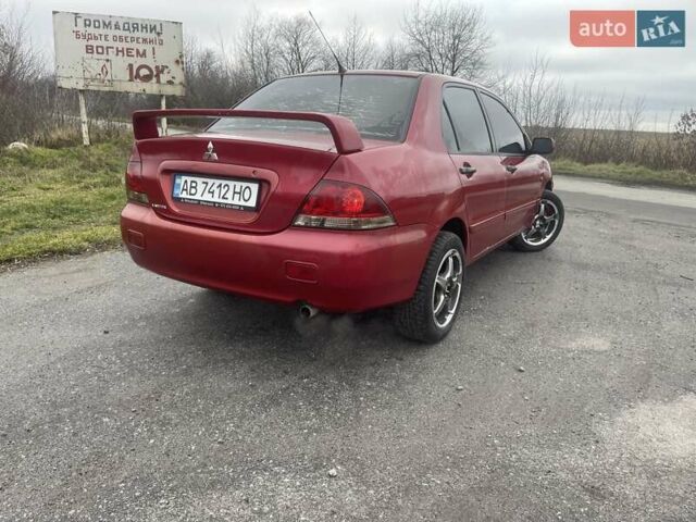Красный Мицубиси Лансер, объемом двигателя 1.3 л и пробегом 250 тыс. км за 3450 $, фото 1 на Automoto.ua