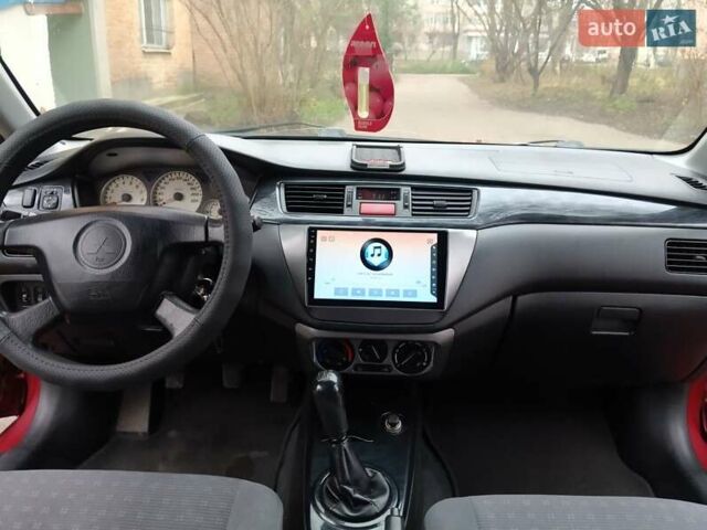 Червоний Міцубісі Lancer, об'ємом двигуна 1.3 л та пробігом 223 тис. км за 4250 $, фото 29 на Automoto.ua