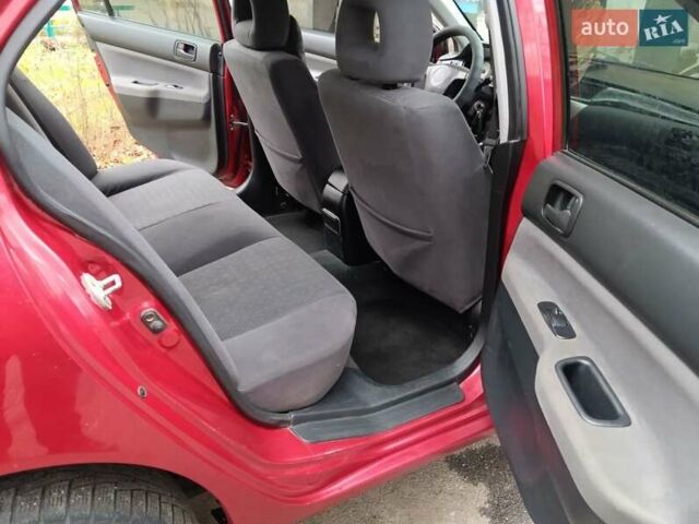 Червоний Міцубісі Lancer, об'ємом двигуна 1.3 л та пробігом 223 тис. км за 4250 $, фото 31 на Automoto.ua