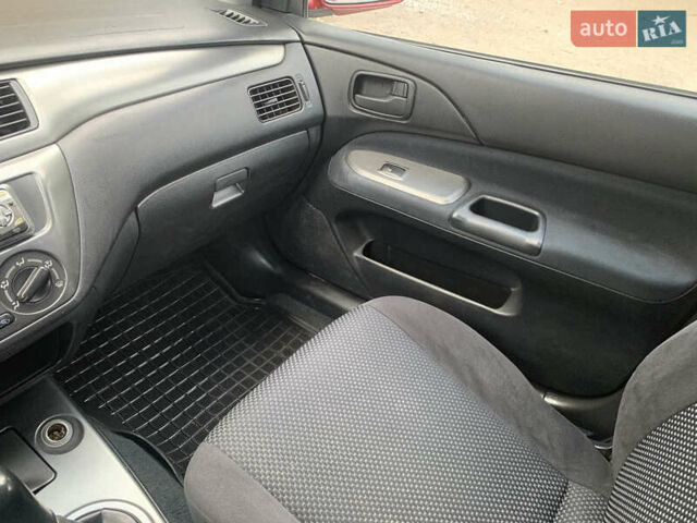 Червоний Міцубісі Lancer, об'ємом двигуна 1.6 л та пробігом 249 тис. км за 4250 $, фото 15 на Automoto.ua