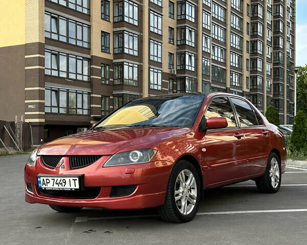 Красный Мицубиси Лансер, объемом двигателя 1.6 л и пробегом 331 тыс. км за 3700 $, фото 7 на Automoto.ua