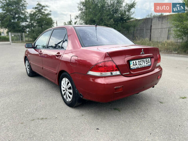 Червоний Міцубісі Lancer, об'ємом двигуна 1.6 л та пробігом 249 тис. км за 4250 $, фото 12 на Automoto.ua