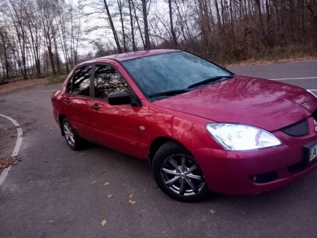 Красный Мицубиси Лансер, объемом двигателя 1.6 л и пробегом 450 тыс. км за 2850 $, фото 1 на Automoto.ua