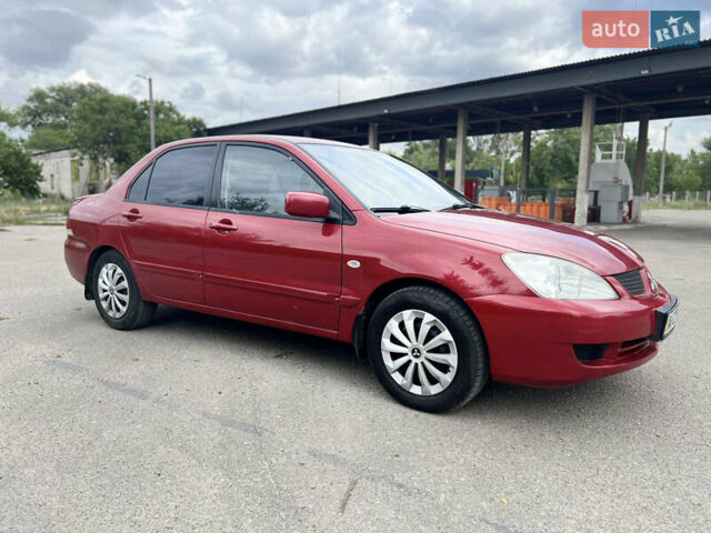 Червоний Міцубісі Lancer, об'ємом двигуна 1.6 л та пробігом 249 тис. км за 4250 $, фото 6 на Automoto.ua