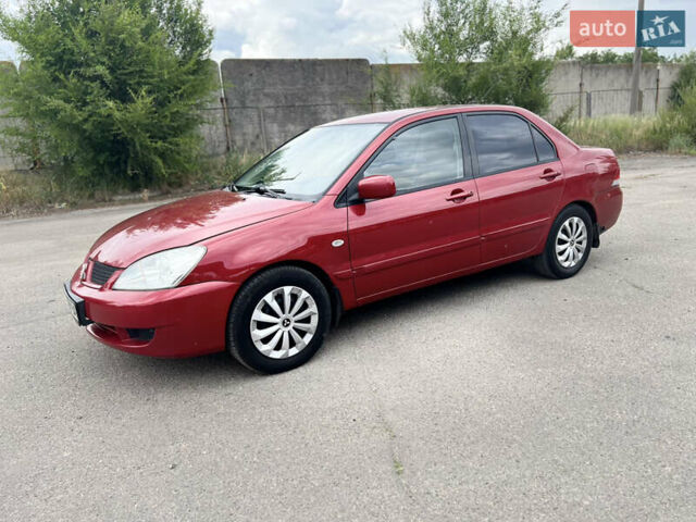 Червоний Міцубісі Lancer, об'ємом двигуна 1.6 л та пробігом 249 тис. км за 4250 $, фото 2 на Automoto.ua