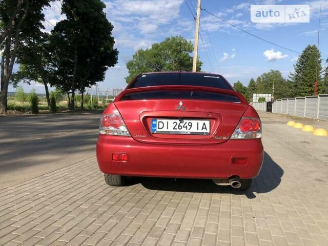 Червоний Міцубісі Lancer, об'ємом двигуна 2 л та пробігом 214 тис. км за 5400 $, фото 4 на Automoto.ua