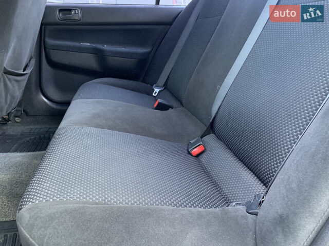 Червоний Міцубісі Lancer, об'ємом двигуна 1.6 л та пробігом 249 тис. км за 4250 $, фото 19 на Automoto.ua