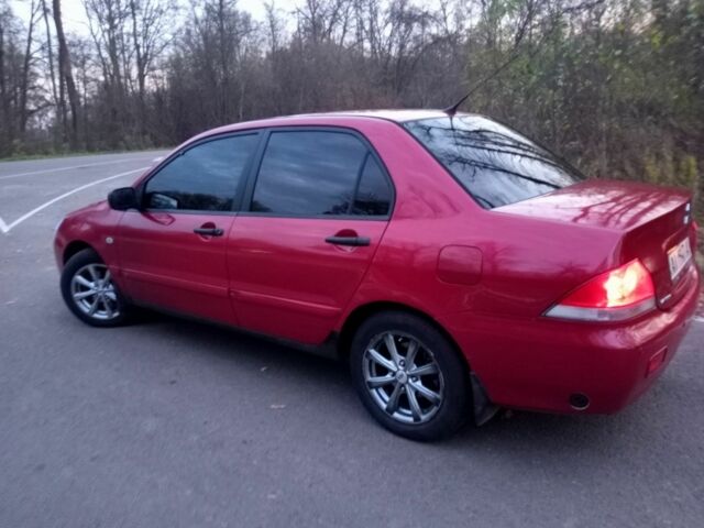 Красный Мицубиси Лансер, объемом двигателя 1.6 л и пробегом 450 тыс. км за 2850 $, фото 3 на Automoto.ua