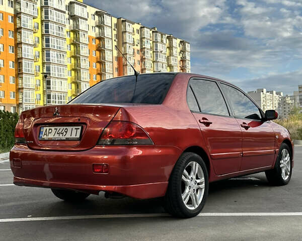 Красный Мицубиси Лансер, объемом двигателя 1.6 л и пробегом 331 тыс. км за 3700 $, фото 4 на Automoto.ua