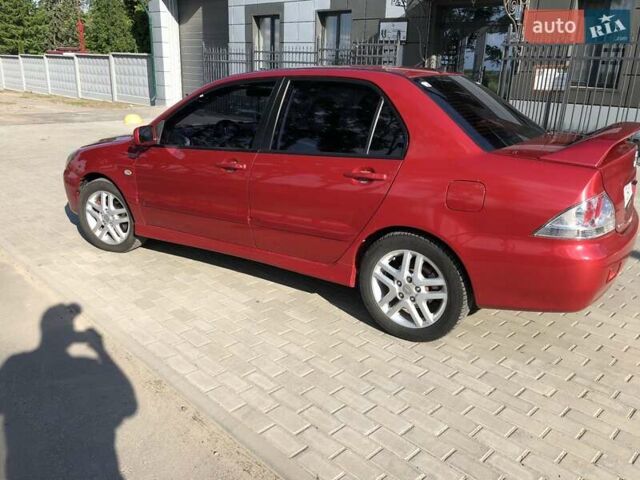 Червоний Міцубісі Lancer, об'ємом двигуна 2 л та пробігом 214 тис. км за 5400 $, фото 2 на Automoto.ua