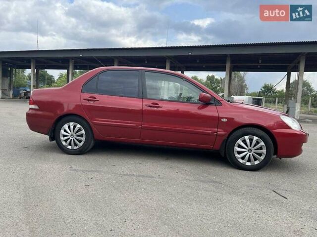 Красный Мицубиси Лансер, объемом двигателя 1.58 л и пробегом 250 тыс. км за 3999 $, фото 7 на Automoto.ua