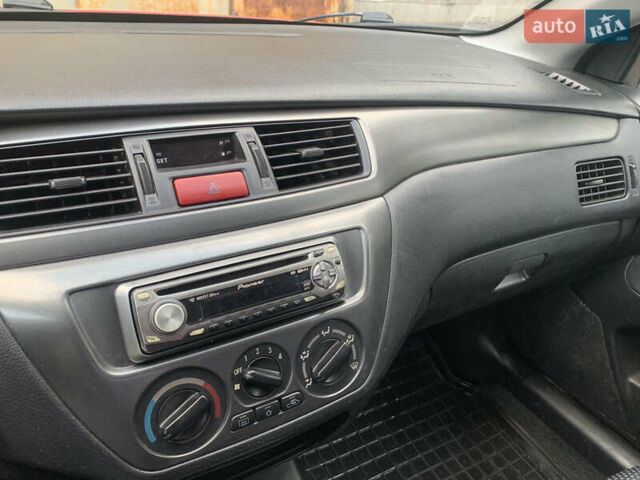 Червоний Міцубісі Lancer, об'ємом двигуна 1.6 л та пробігом 249 тис. км за 4250 $, фото 18 на Automoto.ua